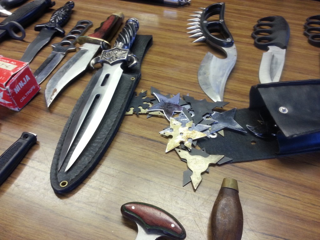 Chinese throwing stars and knives recovered from Seaford home. (Rashed Mian/Long Island Press)