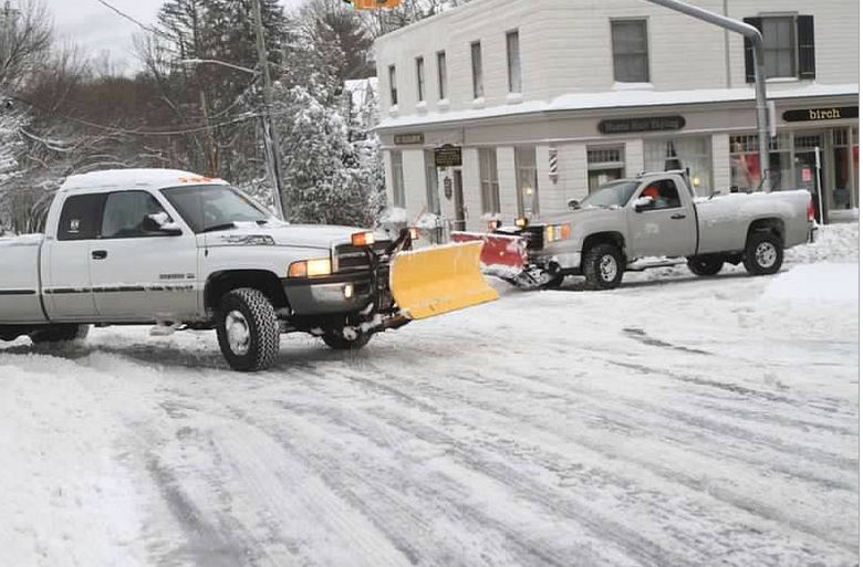 Trucks plowing roads in Locust Valley Saturday morning. (Photo credit: Michael Damm)