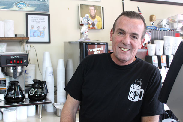 Chris Lawrence, owner of CJ's coffee shop, in Rockville Centre. (Rashed Mian/Long Island Press)