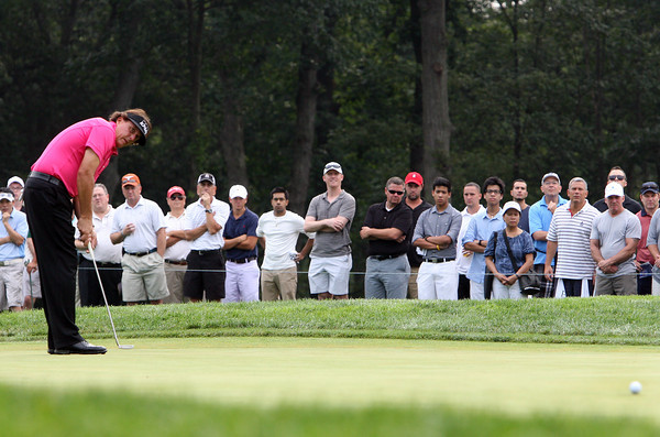 Phil Mickelson putting at Bethpage Black during The Barclays tournament last year. (Kevin Kane/Long Island Press)