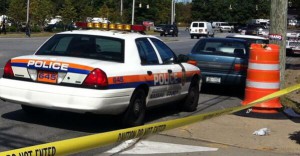 Nassau County Police investigate a shooting in East Garden City Wednesday near the Roosevelt Field Shopping Mall. (Long Island Press/Timothy Bolger)