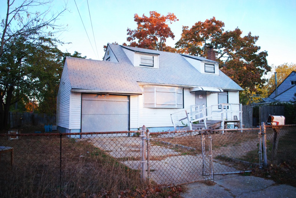 Authorities recently boarded up this vacant house on Ackerman Street in Central Islip, where drugs and prostitution were rampant, to the shagrin of neighbors with young children who live nearby.