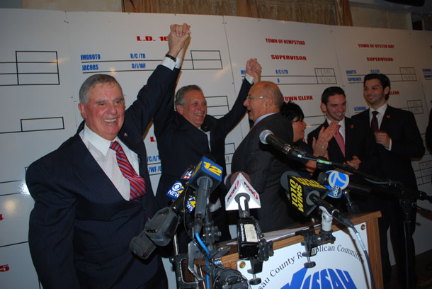 WHAT A NIGHT!: (L-R) Nassau County Republican Party Chairman Joe Mondello, newly re-elected Nassau County Executive Ed Mangano, former senator Alfonse D'Amato and Mangano's family members celebrate the former Bethpage legislator's victory over Tom Suozzi Tuesday, Nov. 5, 2013 at Mirelle's Restaurant & Catering in Westbury. (Christopher Twarowski/Long Island Press)