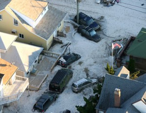 Much of the South Shore community of Long Beach was buried in sand and destroyed following the wrath of Superstorm Sandy Oct. 31, 2012. (Kevin Kane/Long Island Press)
