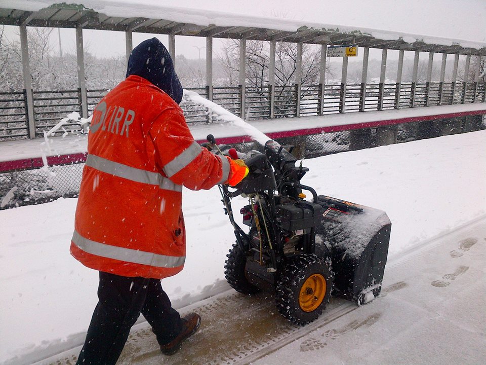 A Long Island Rail Road employee cleaning off the platform of one of the railroad's branches. (Photo credit: MTA)