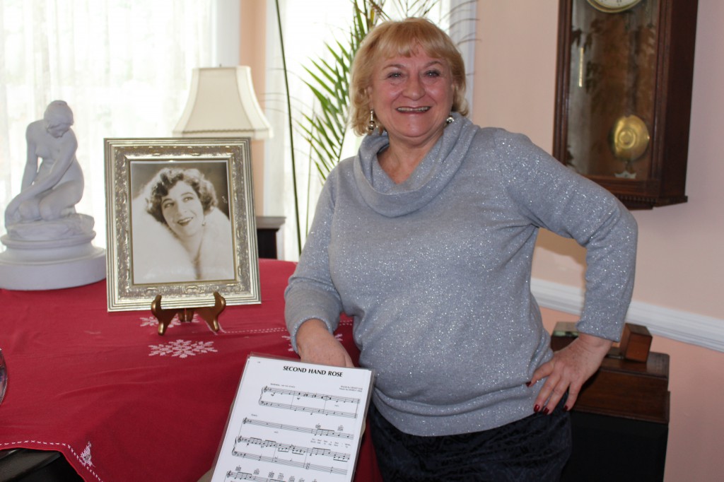 Keeping Fanny Brice’s spirit alive in her former living room is Lynn Pezold. (Rashed Mian/Long Island Press)
