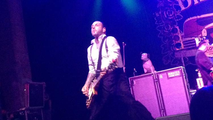 Social Distortion's Mike Ness poses near the edge of the stage during the band's gritty, no-holds-barred set at The Paramount in Huntington, NY Sept. 5, 2014. (Christopher Twarowski/Long Island Press)
