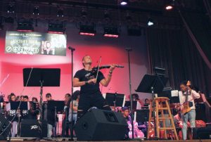Students and Haydn Vitera rock the stage.