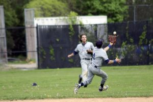 Center fielder Jake Saltzman watches as second baseman (and brother) Ryan snares this challenging short outfield pop-up by Hicksville’s John Strauch.