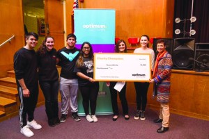 Pictured from left are students Bryan Lezama, Laura Freely, Connor Cruz, Sophia Rancharitar, Optimum Community Public Affairs Manager Allison Aylward, student Emma Azizo and student advisor Donna Rosenblum