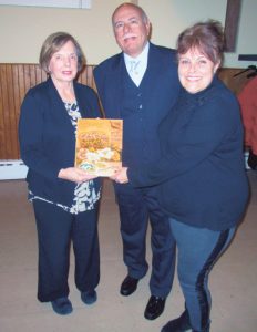 From left: Ann Corbett, James A. Trent, president of the Queen County Museum Board and Amy Fischetti-Boncardo, executive director of the Queens County Farm Museum.