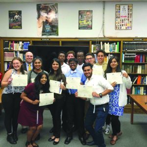 Sewanhaka High School inducted 20 students into its National Social Studies Honor Society Induction. The students are pictured with adviser Michael Sakowich.