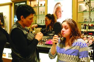 Ariana Greico looks over her new makeup from a Bobbi Brown makeup artist at the Lord & Taylor in Garden City.