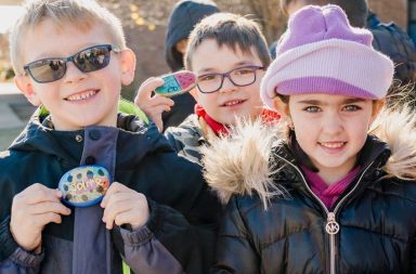 Central Boulevard students place their one-word rocks in a garden bed outside the school as a reminder of their goals this year.