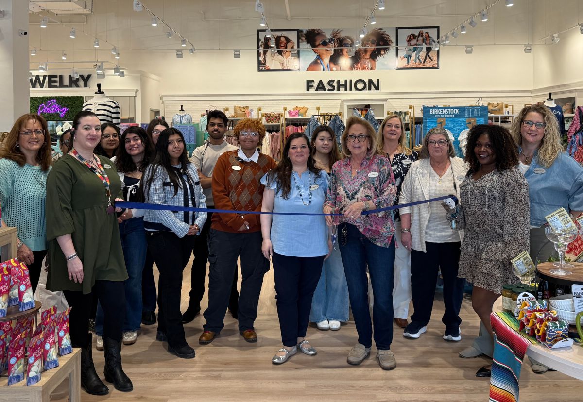 Uncharted staff cutting the ribbon at its grand opening celebration on March 29.