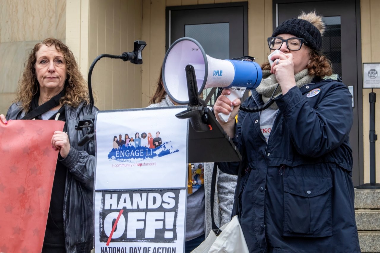 Rachel Klein, of Engage Long Island, spoke at the Mineola Hands Off protest.