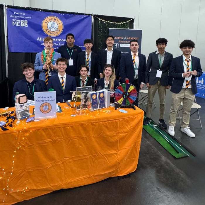 The Manhasset High School Virtual Enterprise team with their “Allergy Armour” booth at the Youth Business Summit on April 8.