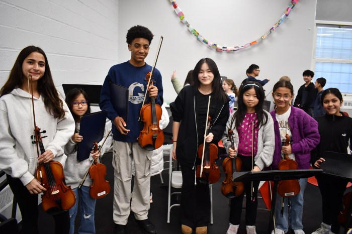 3 Mineola 4th and 8th grade orchestra members rehearsing together 1
