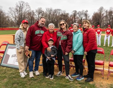Jon Dolecki's wife Irene (center), children and grandson celebrate his legacy at the Saturday, April 5 field renaming