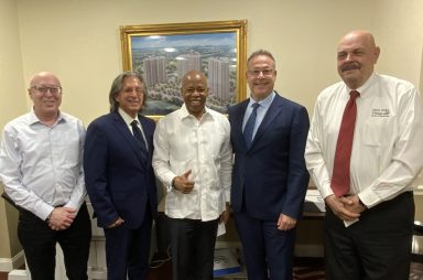 Martin Schwartzman, Geoffrey Mazel, Mayor Eric Adams, Michael Wolf and Bob Friedreich (L. to R.) work to coordinate a town hall discussion for between Adams and North Shore Towers residents.