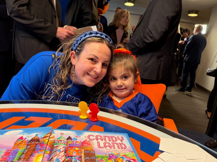 Peyton Albano (R) and her mother Tina (L) at the ribbon cutting for the Clark Gilles Media Room at the Ronald McDonald House in New Hyde Park
