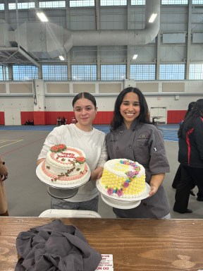 Sewanhaka students with a cake.