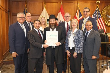 Rabbi Chanan Krivisky and Town of Oyster Bay officials recognize “Education and Sharing Day."