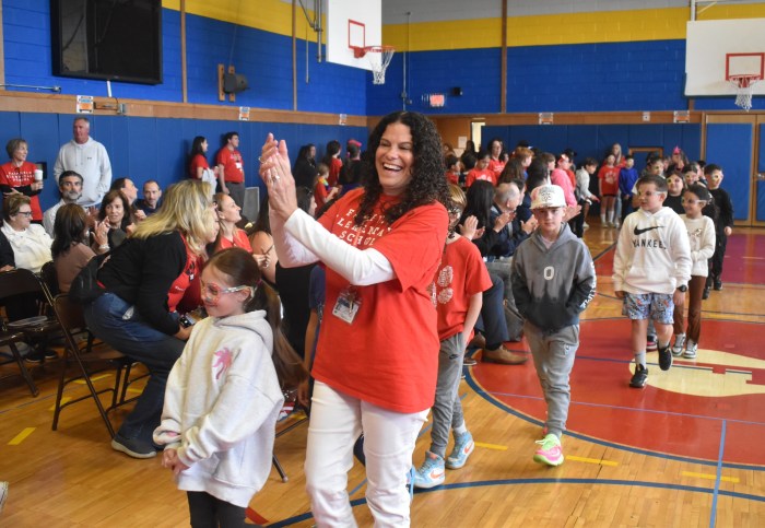 Third grade teacher and Fairfield alum Donna Crowley, celebrated with students during the centennial parade.