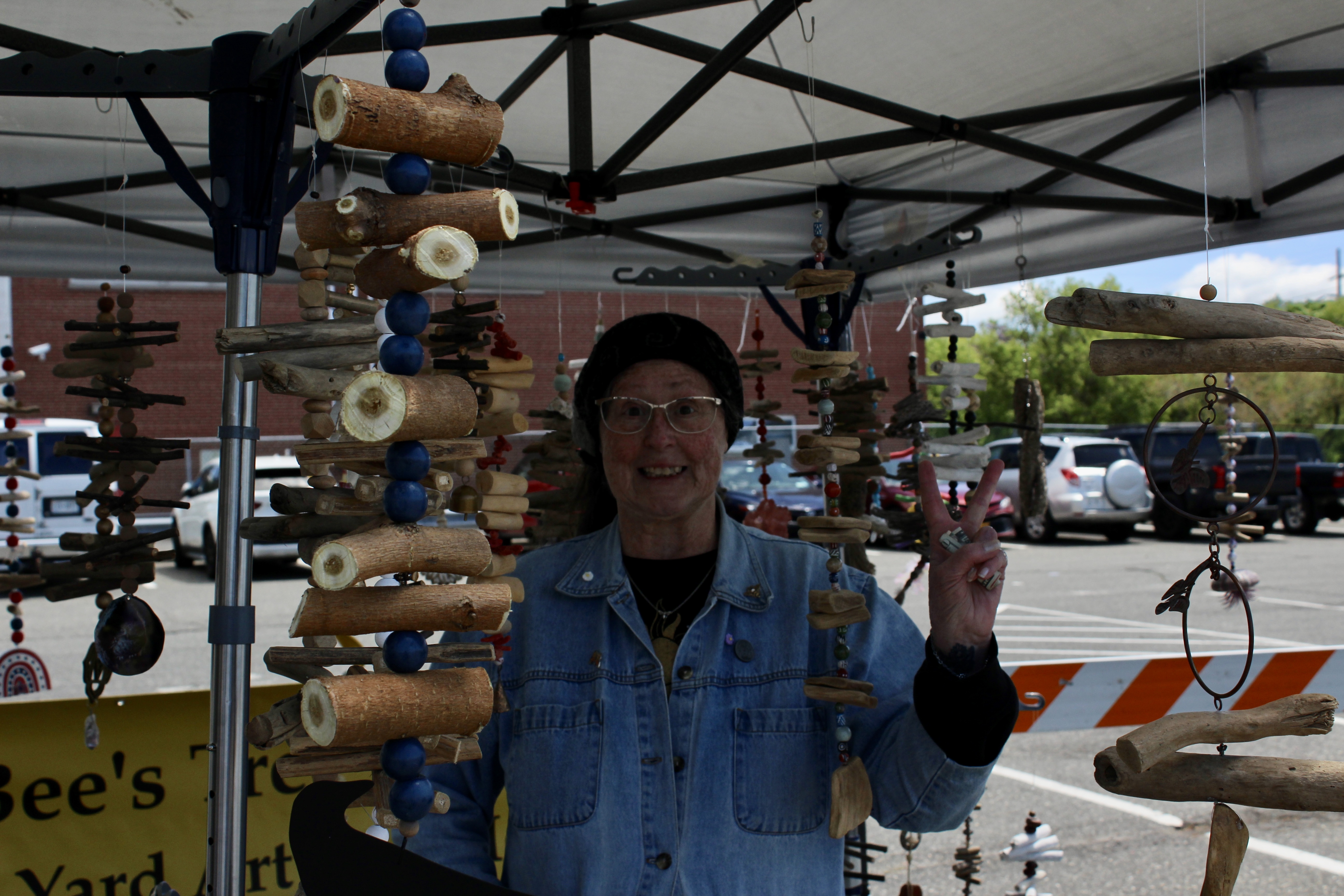 A vendor sells handmade wind chimes.