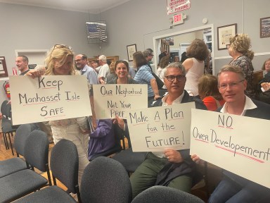Manorhaven residents gathered at village hall to make their voices heard over opposed to a mixed-use development at 30 Sagamore Hill Dr.