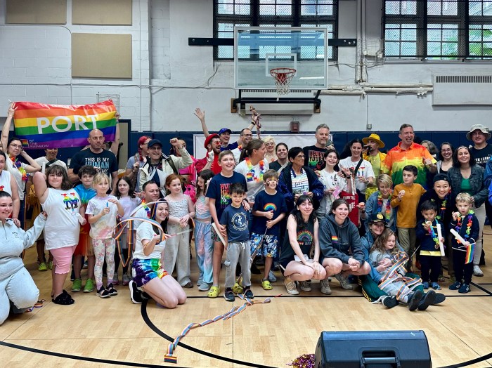 Dozens of community members attended the pride celebration in spite of the rain.
