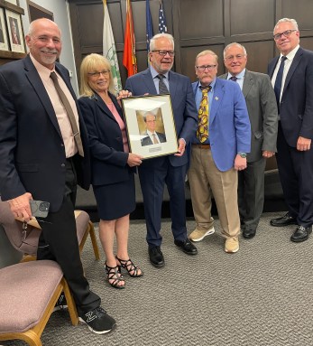 Former Farmingdale Mayor George Graf has his plaque added to 'Wall of Honor'