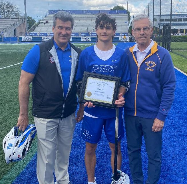 Jacob Apat of Port Washington High School received the James C. Metzger Lacrosse Leadership Award from Long Island lacrosse stars