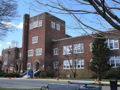 The Manhasset Public Schools is seeking to implement a new cell phone policy to comply with the state's recent bell-to-bell cell phone restriction.