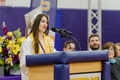 Valedictorian Rose Lindstrom speaks at the Oyster Bay High School 2025 commencement ceremony.