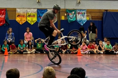 BMX athlete Chris Poulos spoke to Hicksville elementary students.