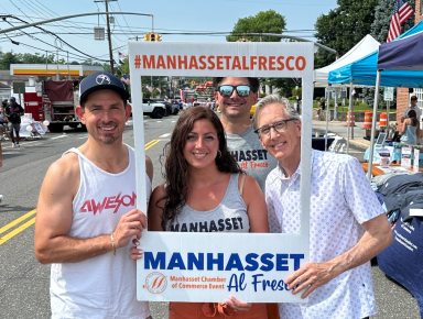 Antoinetta Manzi (C.) celebrates another successful Manhasset Al Fresco.