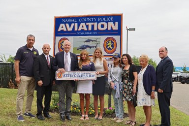 Nassau County officials and the family of Kevin Canavan at street renaming ceremony in Bethpage.