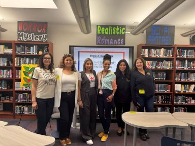 Westbury High School World Language Chairperson Shirley Vargas with authors Sasha Quintanilla, Elvia Sanchez, Adriana Devers, Estefany Ruiz and Melissa Figueroa from Nassau County office of Hispanic Affairs.