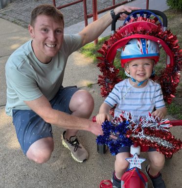 Anthony Izzo (L.) and Eli Izzo (R.) celebrate the 4th of July at Glen Cove's annual bike parade.