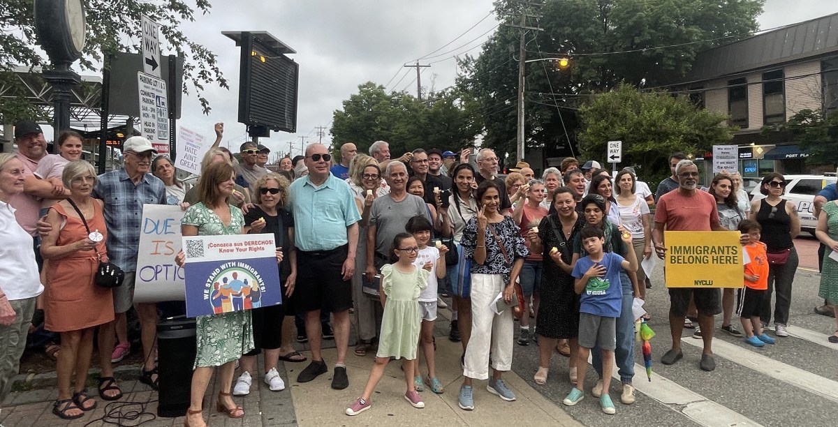 Dozens gathered for a weekly rally in defense of immigrant rights and due process.