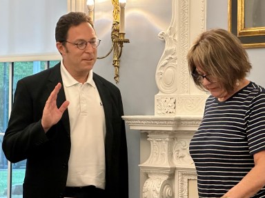 Grant Toch (L.) was sworn in again to serve as the Great Neck Board of Education president.