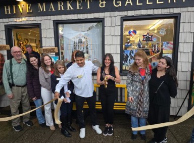 Laura Escobar (Third from R.) cuts the ribbon at Hive Market & Gallery's four year anniversary.