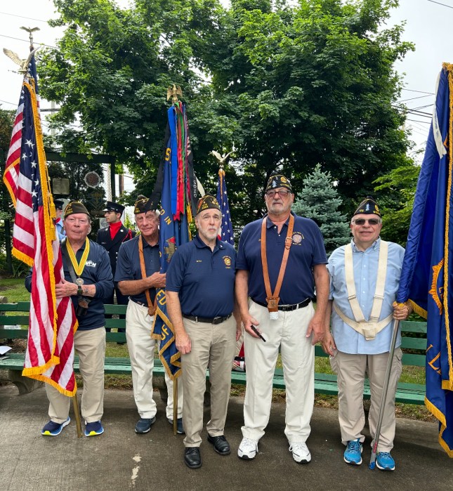 Members of the Syosset VFW Post 6394 stand in Memorial Park after this year's Memorial Day parade.