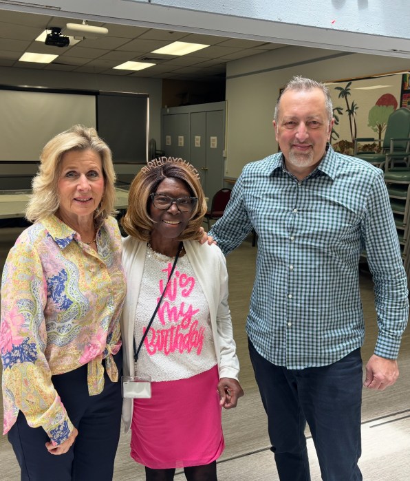 Mayor Pam Panzenbeck, Rotary Club President Toya Davis and David Geliashvili.