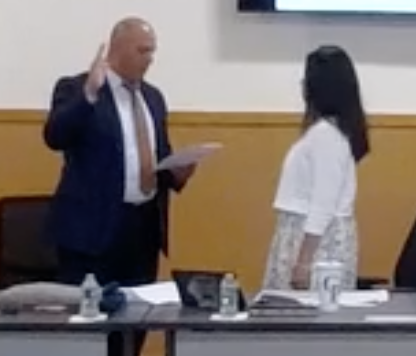 Vanessa Dong-Moncao (R.) was sworn in as the Carle Place Board of Education president, replacing longtime head, Lawrence Zaino.