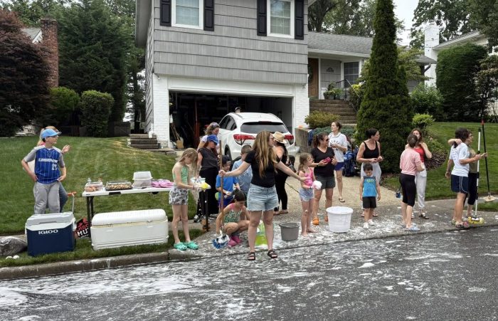Adults and kids worked on washing cars for Logan's Battle.